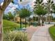 Outdoor exercise area with fitness equipment surrounded by mature landscaping and trees at 4722 Flagler Beach Way, Kissimmee, FL 34746