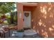 Charming front door adorned with sunflower decor and a 'Welcome' sign, enhanced by a potted plant at 4722 Flagler Beach Way, Kissimmee, FL 34746