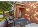 Inviting front porch with cozy chairs, colorful foliage, and decorative 'Welcome' sign at 4722 Flagler Beach Way, Kissimmee, FL 34746