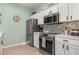 Beautiful kitchen with updated appliances, quartz counters and tile backsplash at 4722 Flagler Beach Way, Kissimmee, FL 34746