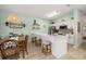 Open kitchen with bar stool seating featuring quartz countertops and modern decor at 4722 Flagler Beach Way, Kissimmee, FL 34746