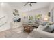 Bright living room features a ceiling fan, stylish decor, and plenty of natural light at 4722 Flagler Beach Way, Kissimmee, FL 34746