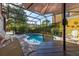 Inviting pool with a brick patio, lush landscape and screened enclosure for comfortable outdoor enjoyment at 4722 Flagler Beach Way, Kissimmee, FL 34746