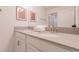 Bright bathroom featuring a double vanity with a quartz countertop and modern fixtures at 4835 Memories Ln, Kissimmee, FL 34746