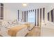 Well-lit bedroom featuring two twin beds, playful décor, and a wall-mounted TV at 4835 Memories Ln, Kissimmee, FL 34746