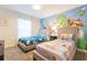 Playful ' bedroom featuring colorful themed decor and comfortable twin beds at 4835 Memories Ln, Kissimmee, FL 34746