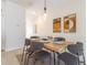 Dining area with modern table, stylish chairs, and contemporary artwork enhancing the inviting atmosphere at 4835 Memories Ln, Kissimmee, FL 34746