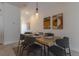Dining room with decor art, wood table, seating for six and modern accents at 4835 Memories Ln, Kissimmee, FL 34746