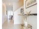 Bright hallway with decorative accents leading to a dining area with modern décor and ample space at 4835 Memories Ln, Kissimmee, FL 34746