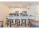 Modern kitchen featuring stainless steel appliances, a breakfast bar with seating, and pendant lighting at 4835 Memories Ln, Kissimmee, FL 34746