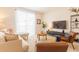 Comfortable living room with a modern sofa, stylish decor, and sliding doors to a porch at 4835 Memories Ln, Kissimmee, FL 34746
