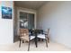 Cozy patio with a dining table set for four, ideal for enjoying outdoor meals and gatherings at 4835 Memories Ln, Kissimmee, FL 34746