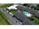 Overhead shot of a building complex featuring a pool, parking area, and landscaping at 5245 W Irlo Bronson Memorial Hwy # 210, Kissimmee, FL 34746