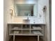 Bathroom featuring a modern floating sink, hair dryer, and storage shelves at 5245 W Irlo Bronson Memorial Hwy # 210, Kissimmee, FL 34746