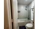 Bathroom with tub-shower, showerhead, toilet, and towel rack at 5245 W Irlo Bronson Memorial Hwy # 210, Kissimmee, FL 34746