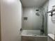 Bathroom with tub-shower, showerhead, toilet, and towel rack at 5245 W Irlo Bronson Memorial Hwy # 210, Kissimmee, FL 34746