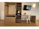Bedroom cabinet featuring a mini fridge, safe, microwave, and desk at 5245 W Irlo Bronson Memorial Hwy # 210, Kissimmee, FL 34746