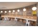 Brightly lit co-working space with individual work stations, pendant lighting, and seating at 5245 W Irlo Bronson Memorial Hwy # 210, Kissimmee, FL 34746
