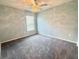 Bright bedroom with ceiling fan, ample natural light, and neutral-colored walls, perfect for relaxation at 561 Vittorio Dr, Winter Haven, FL 33884