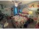 Charming bedroom with floral bedding, decorative pillows, and coordinated decor for a cozy retreat at 561 Vittorio Dr, Winter Haven, FL 33884