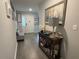 Inviting foyer with stylish decor, console table, and wood-look flooring offers a warm welcome into the home at 561 Vittorio Dr, Winter Haven, FL 33884