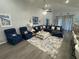 Spacious living room features comfortable seating, an open floor plan, and plenty of natural light at 561 Vittorio Dr, Winter Haven, FL 33884