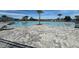 Community pool with a splash pad, palm trees and lounge chairs at 561 Vittorio Dr, Winter Haven, FL 33884