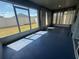 Bright sunroom with ample light, screened windows, and views of the backyard at 561 Vittorio Dr, Winter Haven, FL 33884