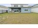Spacious backyard with a covered patio ideal for outdoor relaxation and entertaining at 6019 Forest Perch Dr, St Cloud, FL 34771