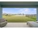 Serene backyard view overlooking a pond and well-maintained green space at 6019 Forest Perch Dr, St Cloud, FL 34771
