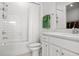 Well-lit bathroom featuring subway tile, a shower and tub combo, and a modern vanity with storage at 6019 Forest Perch Dr, St Cloud, FL 34771