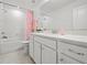 Bright bathroom featuring a quartz countertop, subway tile, and modern fixtures at 6019 Forest Perch Dr, St Cloud, FL 34771