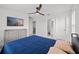 Bedroom featuring carpet, neutral walls and tv, with a dresser for storage at 6019 Forest Perch Dr, St Cloud, FL 34771