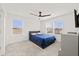Bedroom with carpet and neutral colored walls providing natural lighting through two large windows at 6019 Forest Perch Dr, St Cloud, FL 34771
