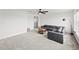 Cozy bonus room with carpet flooring and a lake view from large windows at 6019 Forest Perch Dr, St Cloud, FL 34771