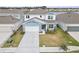 Beautiful two-story home with well-manicured lawn and attached two-car garage at 6019 Forest Perch Dr, St Cloud, FL 34771