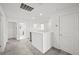 Upstairs hallway with carpet and white walls at 6019 Forest Perch Dr, St Cloud, FL 34771