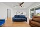 Spacious living room with hardwood floors is open and bright with access to other rooms at 6019 Forest Perch Dr, St Cloud, FL 34771