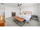 Spacious bedroom with a leather bench at the foot of the bed and neutral color scheme at 6019 Forest Perch Dr, St Cloud, FL 34771