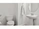 Simple powder room with a pedestal sink, a round mirror, a toilet, and neutral wall color at 6019 Forest Perch Dr, St Cloud, FL 34771