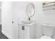 Modern bathroom featuring a vessel sink, toilet, and shelving at 650 Mesilla Dr, Kissimmee, FL 34758