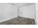 Spacious bedroom with ample closet space and wood-look floors at 650 Mesilla Dr, Kissimmee, FL 34758