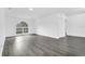 Bright living room featuring wood floors, white walls, and a large window at 650 Mesilla Dr, Kissimmee, FL 34758