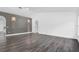 Expansive living room with gray flooring, a gray accent wall, recessed lighting, and lots of natural light at 650 Mesilla Dr, Kissimmee, FL 34758