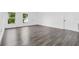 Bright open space with vinyl flooring, white walls, natural light from large windows and neutral colors at 650 Mesilla Dr, Kissimmee, FL 34758