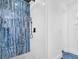 Shower with a large shower head, hand held sprayer and mosaic tiling at 650 Mesilla Dr, Kissimmee, FL 34758
