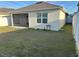 Backyard featuring screened in patio and newly installed vinyl fence at 6783 Grace Hammock Rd, Harmony, FL 34773