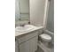 Bathroom featuring a single sink vanity with white cabinets at 6783 Grace Hammock Rd, Harmony, FL 34773