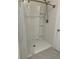 Modern shower with built in shelving and tile surround at 6783 Grace Hammock Rd, Harmony, FL 34773