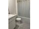 Bathroom featuring a shower/tub combo with white shower curtain at 6783 Grace Hammock Rd, Harmony, FL 34773